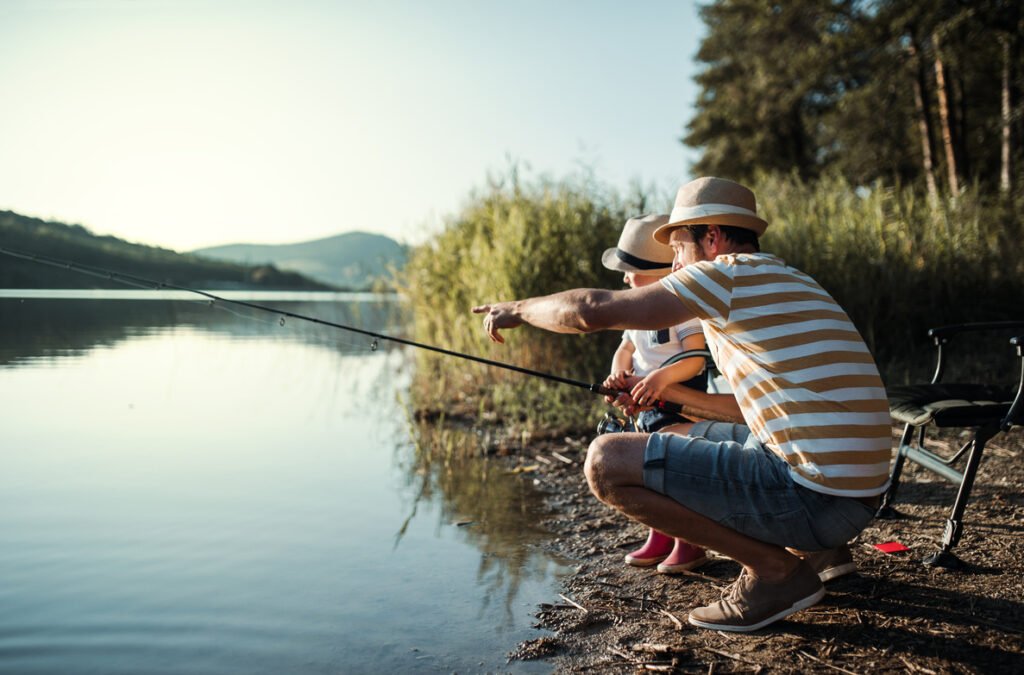 Father and Son Fishing by a Lake