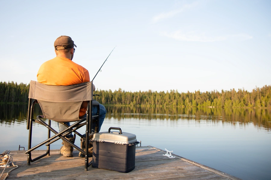 man fishing on a dock